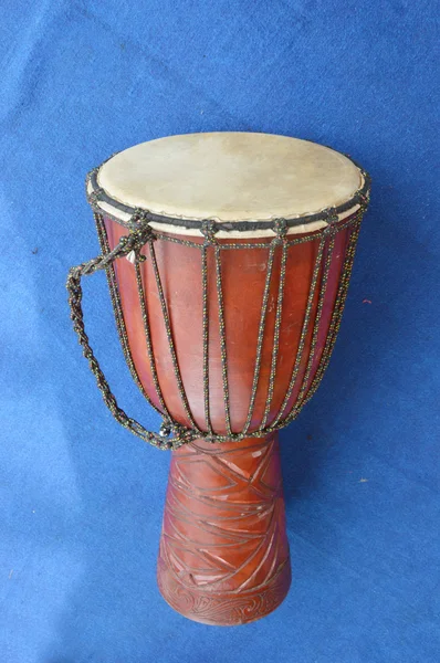 Traditional drum on the blue carpet — Stock Photo, Image