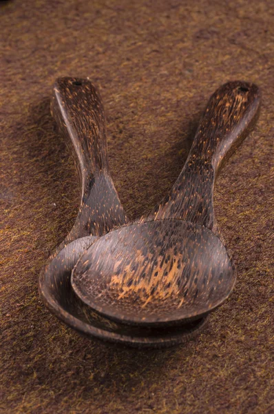 Two wooden spoon on the brown table — Stock Photo, Image