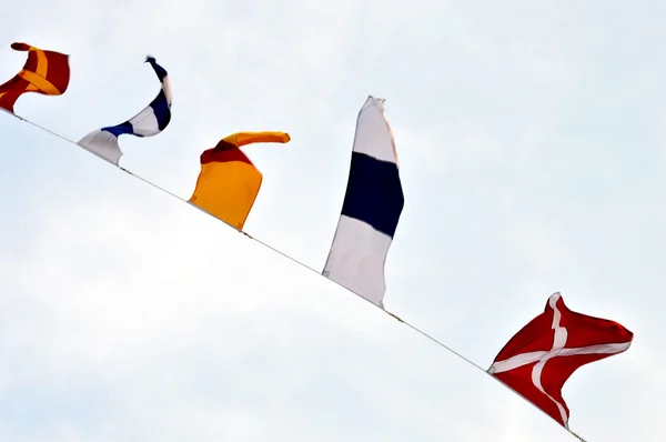 Maritime flags against blue sky — Stock Photo, Image