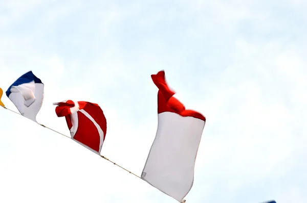 Maritime flags against blue sky — Stock Photo, Image