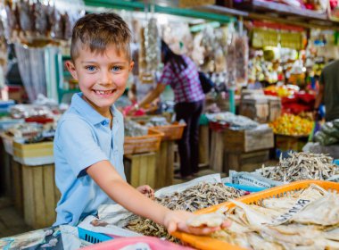 Boy at fish market clipart
