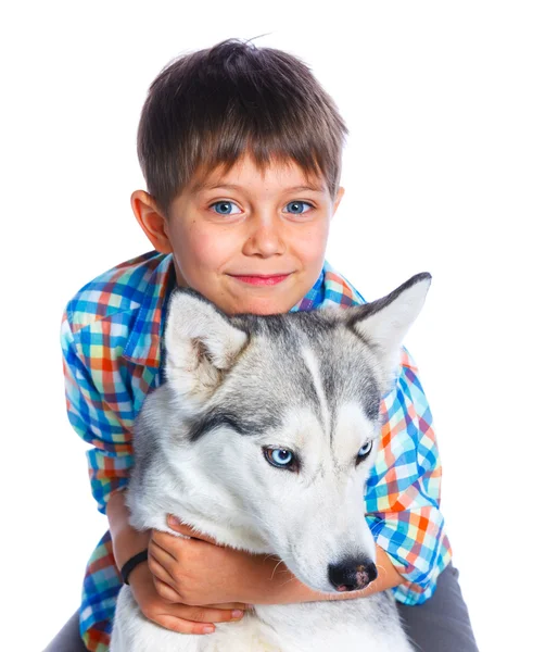 Chlapec s jeho pes husky — Stock fotografie