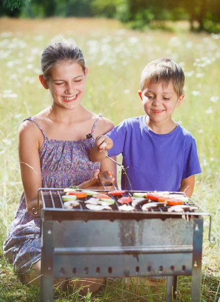 Children grilling vegetable. — Stock Photo, Image