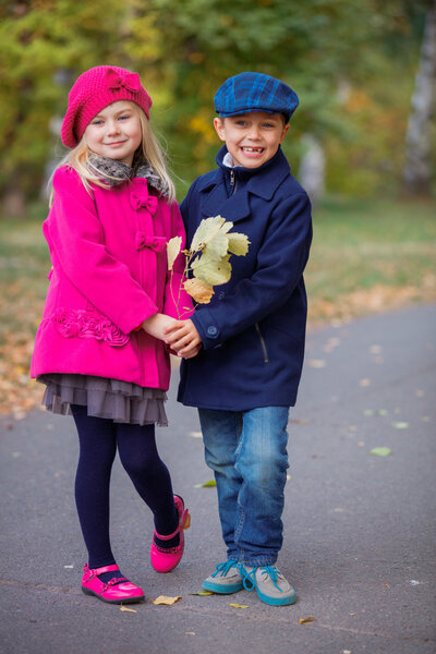 Happy Kids in Autumn Park