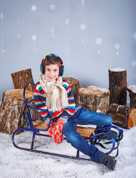 Winter Fashion. Portrait of adorable happy boy.