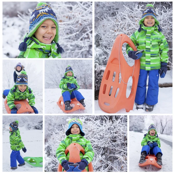 Lille dreng har det sjovt med slæde i vinterparken - Stock-foto