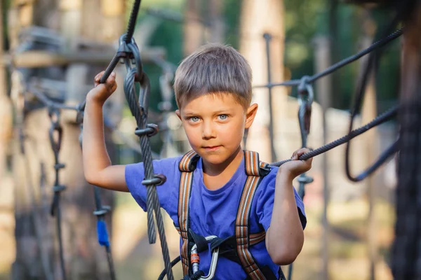 Boy in a climbing adventure park — Stock Photo, Image