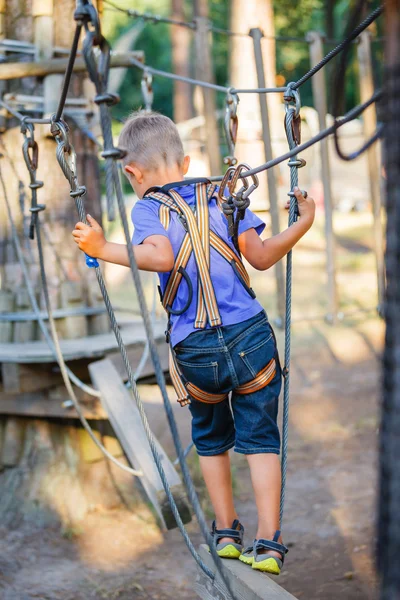 Boy in a climbing adventure park — Stock Photo, Image