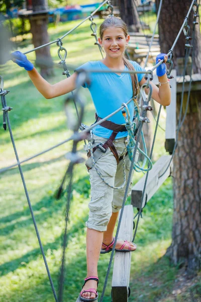 Girl in a climbing adventure park — Stock Photo, Image