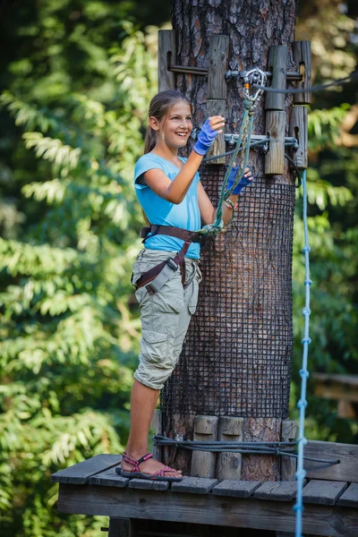 Girl in a climbing adventure park — Stock Photo, Image