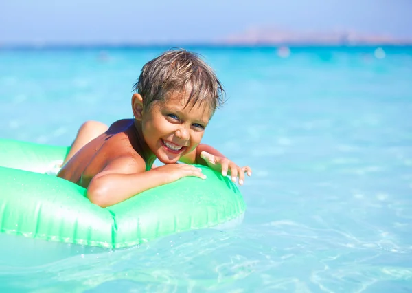 Boy playing in the sea — Stock Photo, Image