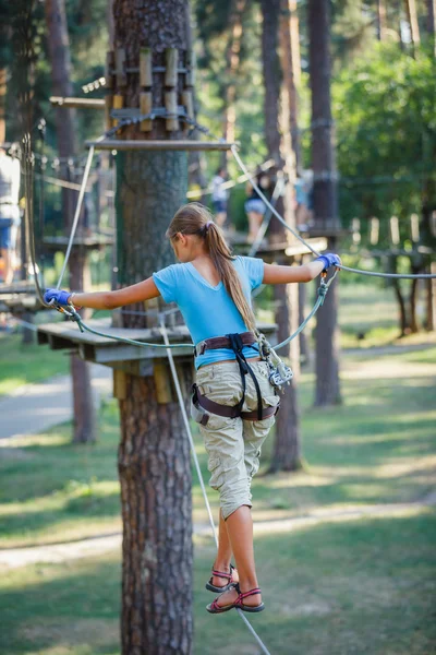 Girl in a climbing adventure park — Stock Photo, Image