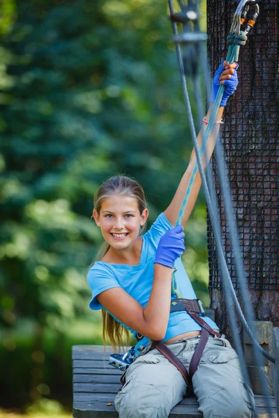 Girl in a climbing adventure park — Stock Photo, Image