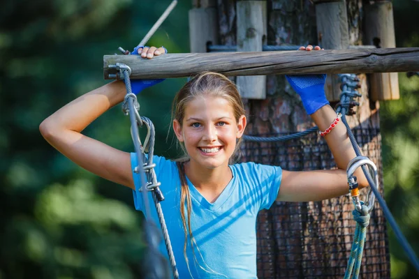 Girl in a climbing adventure park — Stock Photo, Image