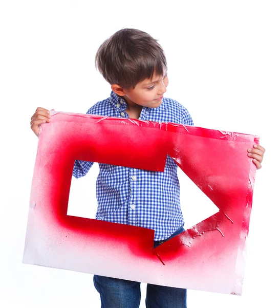 Carino ragazzo tenendo rosso freccia — Foto Stock