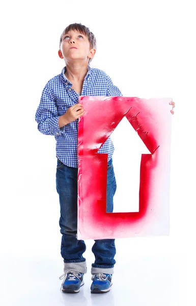 Cute boy holding red arrow — Stock Photo, Image