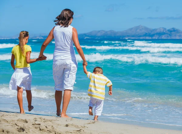 Mother with kids on beach — Stock Photo, Image