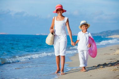 Kids walking at the beach