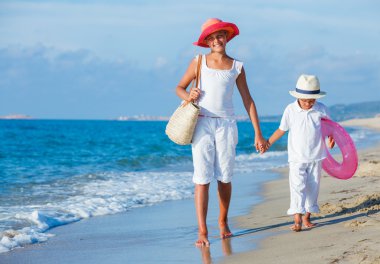 Kids walking at the beach