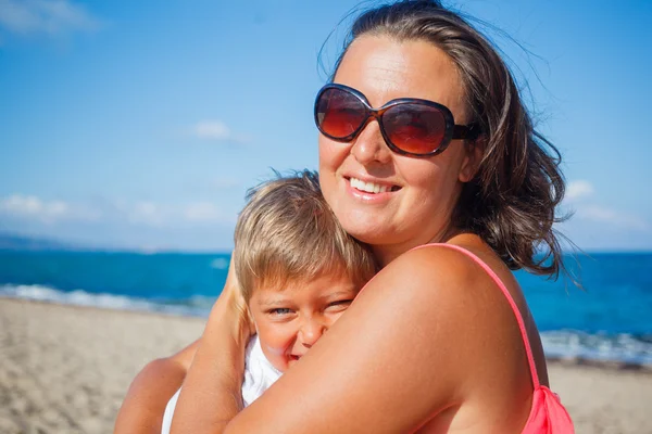 Mother and her son at beach — Stok fotoğraf