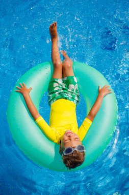 Little boy relax in pool