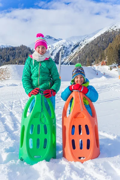 Happy kids sledding — Stock Photo, Image