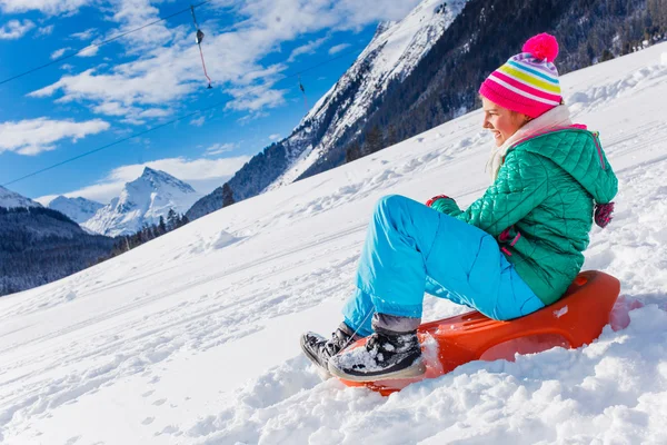 Happy girl sledding — Stock Photo, Image