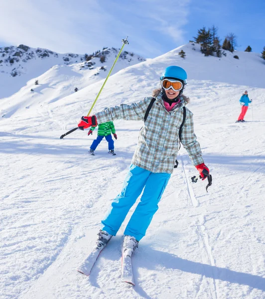 Girl skier in winter resort Royalty Free Stock Images