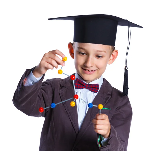Malý chlapec v akademických klobouku — Stock fotografie