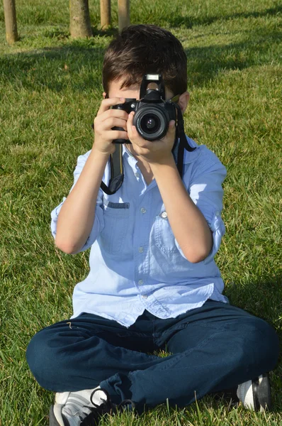 Young boy photographer — Stock Photo, Image