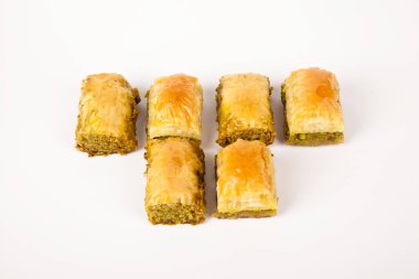 Baklava with pistachio, one of the most beautiful desserts of Turkish cuisine and metal fork knife. Turkish dessert baklava