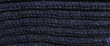 Yünden desenli kumaş. El yapımı örgü kumaş koyu mavi yün arkaplan dokusu