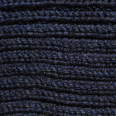 Yünden desenli kumaş. El yapımı örgü kumaş koyu mavi yün arkaplan dokusu