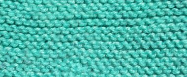 Yünden desenli kumaş. El yapımı örgü kumaş turkuaz yün arkaplan dokusu