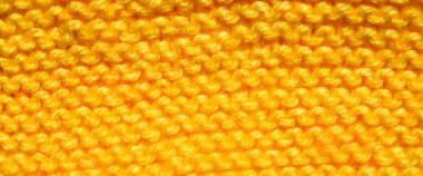 Yünden desenli kumaş. El yapımı örgü kumaş sarı yün arkaplan dokusu