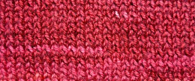 Yünden desenli kumaş. El yapımı kumaş, kırmızı yün arkaplan dokusu