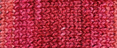 Yünden desenli kumaş. El yapımı kumaş, kırmızı yün arkaplan dokusu