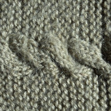 Yünden desenli kumaş. El yapımı örgü kumaş gri yün arkaplan dokusu