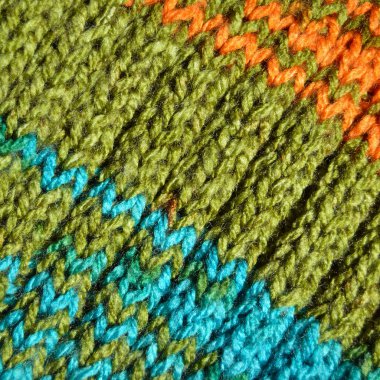 Yünden desenli kumaş. El yapımı örgü kumaş turkuaz ve yeşil yün arkaplan dokusu