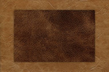 Taklit sığır derisi bej ve kahverengi desen yakın plan, herhangi bir tasarım çalışması için kullanışlı arka plan