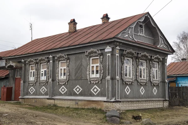 Wooden house with carved window — Stock Photo, Image