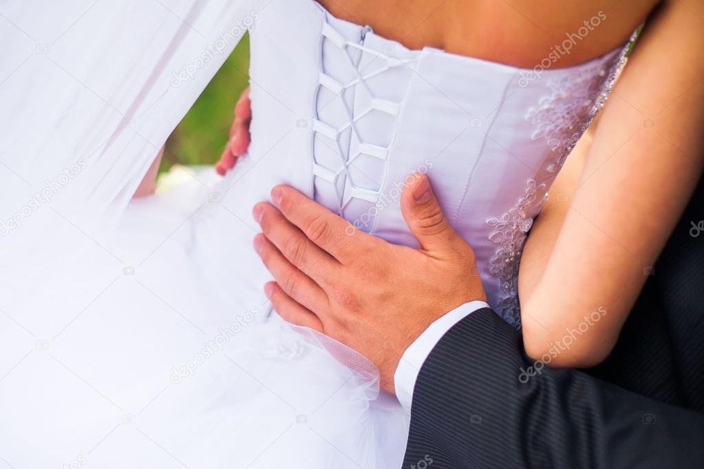 closeup shot of newlyweds hands