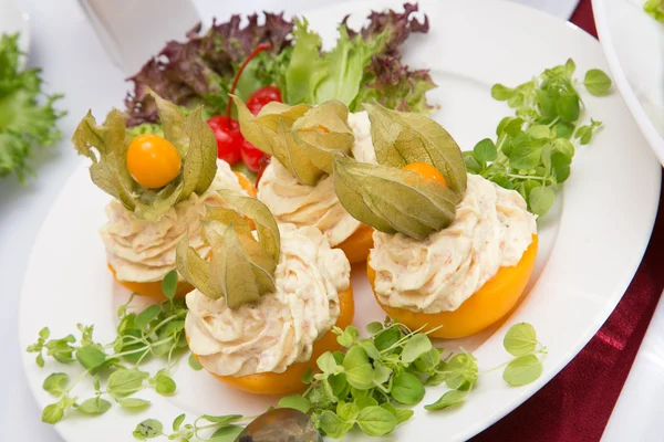 Dish with stuffed peach and cherry — Stock Photo, Image