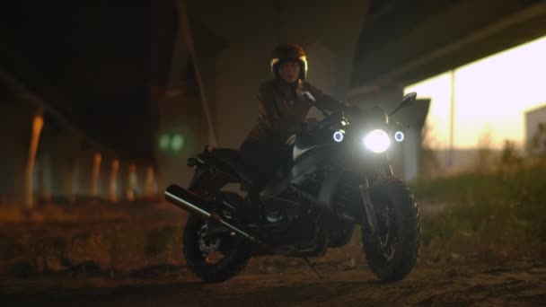 Biker Woman Smiling and Sitting On Motorcycle Urban Scene Looking at Camera 4k — стокове відео