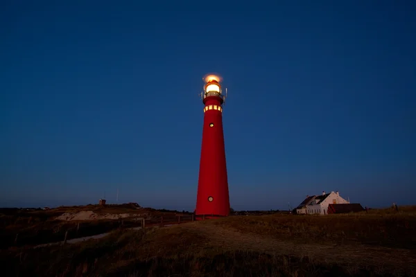 Red lighthouse in the night — Stock Photo, Image