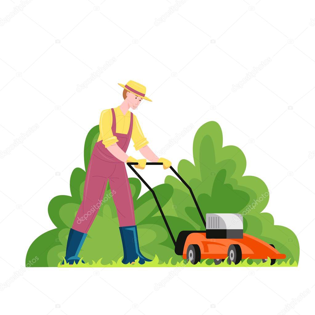 Male gardener mowing lawn with electric mower