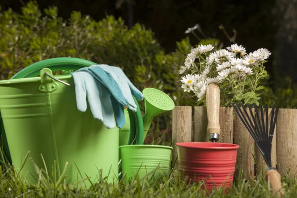 Gardening tools on the grass in the garden — Stock Photo, Image