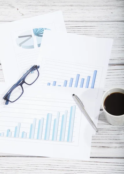 Mix of office supplies and gadgets on a wooden table background. view from above — Stock Photo, Image