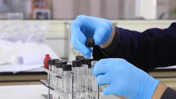 Close Up Of Male Hand Of Doctor Scientist Fill A Test Tube Of Liquid — Stock Video