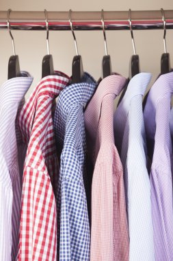 variety of shirts on hangers clipart